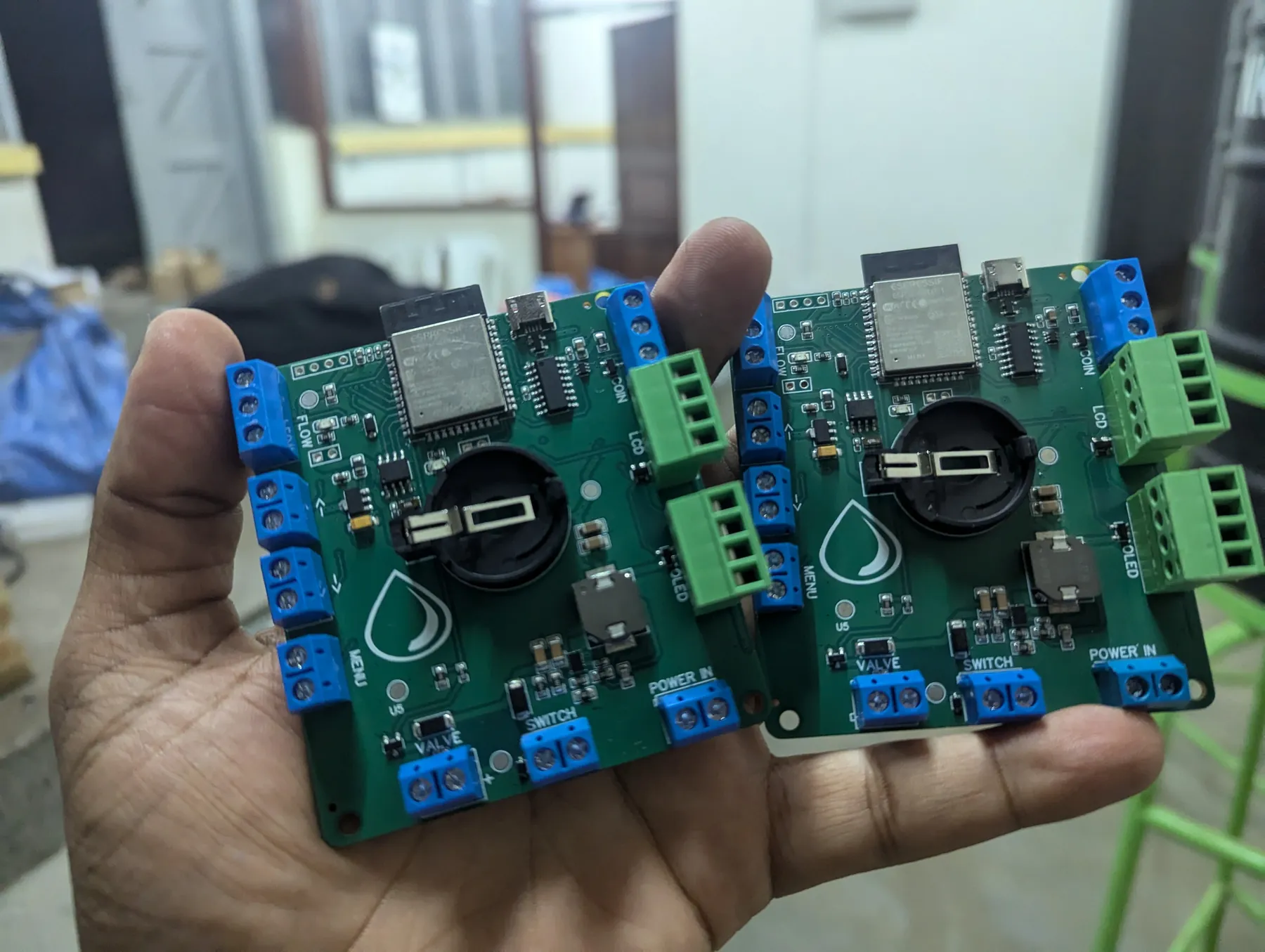 Water vending controller boards held in hand